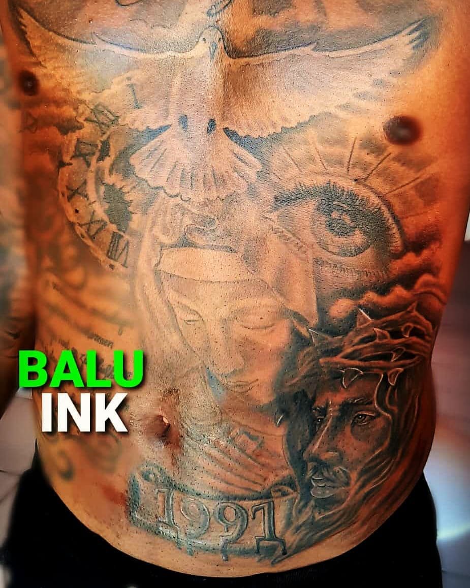 Full torso piece, large-scale black and grey work across the chest and stomach