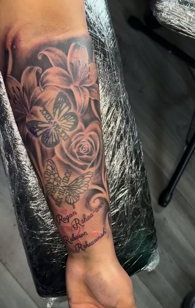 Close-up of a floral black and grey piece at Balu Ink Tattoos